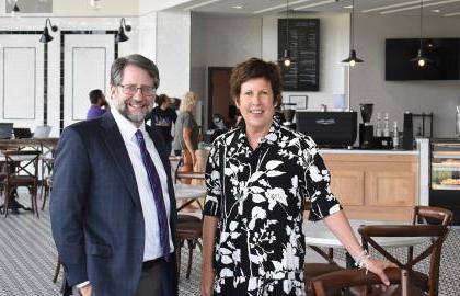 Jody Ruhl and President Jon Peede pose for a photo in the Lyceum Cafe